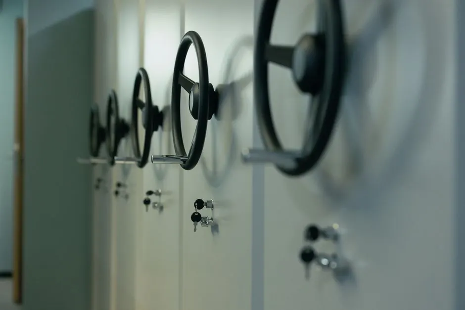 Close-up of industrial safes with manual locks and keys, highlighting security features.
