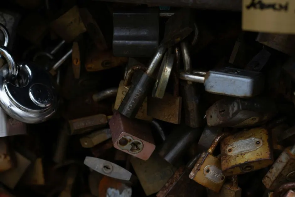 Image showing a pile of rustic and shiny padlocks, symbolizing security.